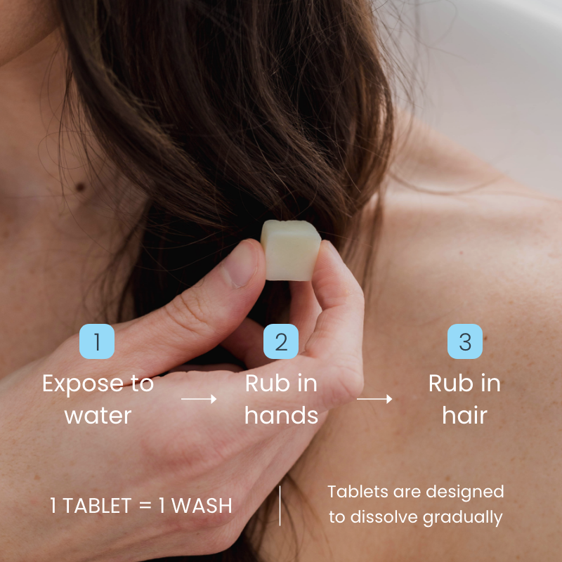 Woman holding eco-friendly body shampoo tablet on hair, paraben-free and sulfate-free